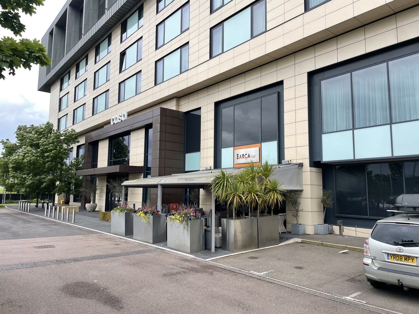 The original outdoor terrace with retractable awning at Casa Hotel before the work