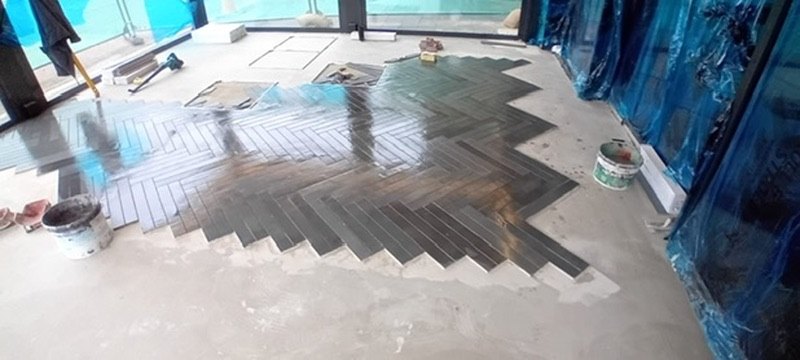 Herringbone tiling laid to match the hotel's existing floors
