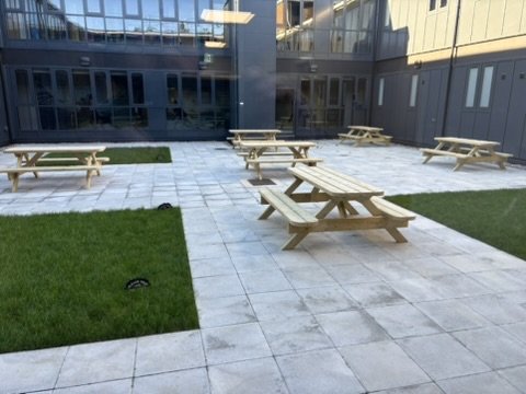 Finished courtyard with paving, lawns and seating