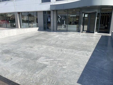Finished large-format porcelain forecourt at a national retail showroom